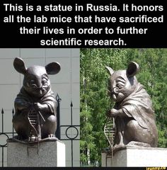 two statues of mice sitting next to each other