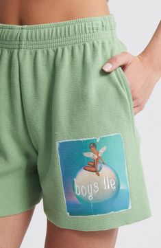 Love to lounge in these soft sweat shorts designed with a vibrant logo graphic. 4" inseam; 12 1/2" leg opening; 11 1/2" front rise; 13 1/2" back rise (size Small) Elastic waist Side-seam pockets 100% cotton Machine wash, tumble dry Imported Summer Short Sweatpants For Loungewear, Green Casual Athletic Shorts For Loungewear, Casual Green Athletic Shorts For Loungewear, Graphic Print Cotton Shorts For Leisure, Green Athletic Shorts For Loungewear And Athleisure, Green Sweats For Loungewear, Athleisure Shorts With Letter Print For Loungewear, Green Athletic Shorts For Loungewear, Athleisure Letter Print Shorts For Loungewear