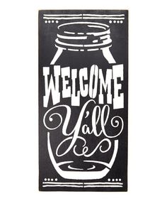 a black and white sign that says welcome fall with a mason jar in the center