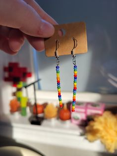 If you're looking to add a little color to your life, here's the perfect chance. here are some adorable rainbow seed beads to spruce up your life! Dangly Earrings, Coat Hooks, Seed Beads, Jewelry Earrings Dangle, Etsy Earrings, Dangle Drop Earrings, Dangle Earrings, Handmade Items, Jewelry Earrings