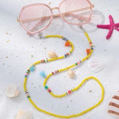 This Unique Glasses Chain Cowrie Puka Seashell Piece Is A Wonderful Addition To Your Wardrobe And Your Style; Sure To Get Lots Of Compliments! Y2k Vsco 90s Coastal Cottagecore Gshmhy00y0006fs Coastal Cottagecore, Beaded Glasses, Glasses Inspiration, Unique Glasses, Glasses Strap, Puka Shell, Bead Projects, Eyeglass Chain, Eyeglass Holder