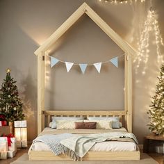 there is a bed that has been made and decorated for christmas