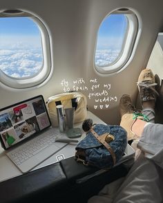 an airplane seat with a laptop and other items on it next to a window that reads, only with me to begin for my traveling