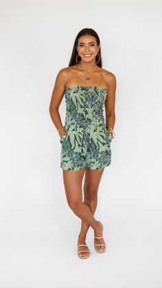 Say hello to a posh and playful summer piece—the Kamea romper is an easy favorite for days spent under the sun or strolling through busy sidewalks. Boasting a strapless ruched top and relaxed shorts, stay calm and comfy even when the sun shines high. Wear under a light coverup or denim jacket for an outfit you'll love to wear from dusk until dawn. ** Our Model is wearing a size Small *Smocked Top *Relaxed fit bottom *Side pockets *High Waist Fabric and Care Instructions: *100% Rayon *Hand wash c Until Dawn, Tropical Green, Mini Necklace, Ruched Top, Smocked Top, Stay Calm, Country Outfits, Say Hello, The Sun