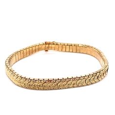 Vintage 14k yellow gold snake skin style bracelet. The links have an engraved "florentine" finish on top that are attached like snake skin and a smooth underside. The bracelet measures 7.25" long and .25" wide, and the plunger clasp has a safety latch. The bracelet weighs 16.17 grams of gold. Elegant Gold Snake Shape Bracelet, Elegant Yellow Gold Snake Bracelets, Luxury Elegant Snake-shaped Bracelets, Flower Wedding Band, Luxury Vintage Snake-shaped Jewelry, Antique Snake-shaped Yellow Gold Jewelry, Engraved Flower, Plain Bands, Gold Snake