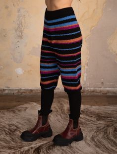 HAREM PANT WITH ELASTIC WAISTBAND IN MULTI-STRIPE PATTERN WITH SOLID WITH RIBBED CUFFS 92%RECYCLED POLYESTER 5%WOOL 3%ELASTAN Ka'ui is 5'8" wearing a size S/M STYLE# M6223 Available sizes: S/M, M/L Yarn Accessories, Knit Ideas, Harem Pant, Outerwear Vest, Tomboy Fashion, Sweater Sale, Knit Pants, Quilt Ideas, Granada