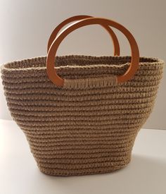 Hand crochet bag. New. Natural jute. There is such an unusual shape jute handmade basket bag with wooden handles ....  Size: height without handle 25 cm/10 inches, top width 38 cm/15 inches, bottom length 24 cm/9.5 inch and width 13 cm/5 inch... Beige Crochet Bag With Braided Round Handles, Beige Crochet Bag With Round Handle For Shopping, Handmade Jute Crochet Bucket Bag, Daily Use Jute Shoulder Bag With Round Handle, Jute Crochet Bucket Bag, Shopping Crochet Bag With Woven Round Handle, Shopping Crochet Bag With Round Handle, Beige Crochet Bucket Bag With Braided Handles, Crochet Shopping Bag With Round Handle