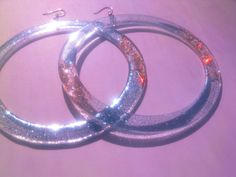 Extra Large Hoop Earrings, Huge Sparkly Party Hoops, 4 Inch Laser Cut Clear Acrylic Festival Hoops, Funky Extravagant Disco Glitter Hoops --Materials: laser cut plexiglass bases, glitter high quality resin, Hooks ~> you can choose material Brass OR Sterling Silver --Dimension: 10 cm (4 in) x 12 cm length (4.7 in) These lovelies are so lightweight--> you are going to forget you are wearing them! Firstly, i come up with the design, making some quick sketches, I then design them in my laptop Sparkly Party, Gadgets Gifts, Large Hoop Earrings, Bubble Envelopes, Fun Things, Clear Acrylic, Statement Earrings, Laser Cut, 4 Inch