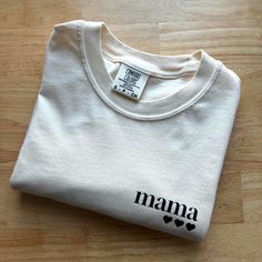 Original Mama of three design on Comfort Colors Heavyweight T-shirt [C1717] made with sustainably and fairly sourced USA Cotton in the color Ivory! personalization available! number of hearts for each child (up to 3 available at this time) Each item is MADE TO ORDER! :) Processing time is currently 7-10 days. Because this is a made to order product, returns are not accepted. However, should you have any issues with your order, please reach out to us.  CARE INSTRUCTIONS:  Turn garment inside out. Machine Wash Cold on Delicate or Hand Wash Cycle. You may tumble dry on lowest heat setting, though this isn't ideal. Lay flat or line dry to extend the lifetime of your item. Relaxed Fit Cotton T-shirt As Gift, White Cotton Top For Mother's Day, White Cotton Tops For Mother's Day, Mother's Day Crew Neck Cotton Shirt, Mother's Day Cotton Crew Neck Shirt, Family Matching Cotton T-shirt Gift, Casual Shirt With Custom Print For Mother's Day, Relaxed Fit Organic Cotton Tops With Custom Print, Graphic Print Cotton Top As Gift