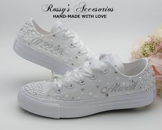 "Beautiful and Romantic wedding sneaker are a perfect accessories for your Special day..These Wedding Chuck Taylor All Star White Color Low Top Converse Sneakers , are embellished with Pearls and Clear Crystal on the Toe and Back , with a White Satin Ribbon shoe lace for tying. This Chuck Taylor All Star Monochrome Low Top runs a half-size large. Handmade to order, so please allow me enough time before your wedding date. Orders are processed and shipped within 7-8 WEEKS of payment., large orders Bedazzled Wedding Shoes, Wedding Chucks Converse, White High-top Sneakers For Wedding, White Round Toe Sneakers For Bridal Shower, Custom White High-top Wedding Sneakers, White Low-top Wedding Shoes, Custom Wedding Sneakers With Round Toe And Laces, Low-top Lace Wedding Shoes For Bride, White High-top Wedding Sneakers