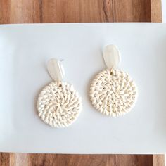 These lightweight rattan earrings are a great addition to your jewelry box. With their neutral resort wear style, these earrings can match anything! They feature a modern, clean design that can be worn every day or with a dressy outfit, and they're light enough to forget you're wearing them as you move around your day. They can go from beachside cocktail to dinner date in a snap, making it the perfect accessory for travel. Hypoallergenic stainless steel posts Durable plant-based acrylic posts Ha Rattan Earrings, White Rattan, Rattan Wood, Patriotic Bows, Dressy Outfit, Fanny Bag, Bridal Shower Dress, Date Dinner, It's Your Birthday