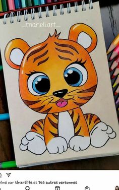 a drawing of a cartoon tiger sitting on top of a desk next to colored pencils