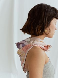 Introducing the ultimate versatile accessory, "The Dreamer" bandana silk scarf. This unique silk scarf showcases a mesmerizing pattern of flowers and treasures that evokes the ethereal and mysterious essence of the fictional worlds. It's a portal to another dimension, transporting you to an enchanted world where anything is possible.  This silk scarf is the perfect accessory to complement any outfit, adding a touch of bohemian chic to your look. Wear it as a headband, wrap it around your neck, o Bandana Silk, Headband Wrap, Silk Neck Scarf, Silk Bandana, Another Dimension, Scarf Top, Pink Scarves, Bandana Scarf, Fictional World