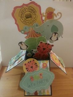 an elephant and monkey themed birthday card holder