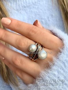 Description : Pearl Stone Cross Silver Ring, Pearl Silver Ring, Pearl Ring, 925 Sterling Silver Ring, Authentic Ring, Mother Day Ring, christmas day gift pearl ring, Five Stone Ring, coral pearl ring, mother of pearl ring, 925 silver pearl, pearl silver ring, sterling silver ring, white pearl ring, freshwater pearl, mother of pearl, multi stone ring, pearl ring silver, silver pearl ring Handmade item Materials: Pearl , Silver Gemstone: Pearl,  Gem color: White Band color: Silver/Gold Style: Minimalist Recycled Silver Sterling Pearl Ring, White Sterling Silver Pearl Ring, White Pearl Sterling Silver Ring, White Nickel-free Rings For Anniversary, Adjustable Silver Pearl Promise Ring, White Sterling Silver Pearl Ring Gift, Rose Gold Sterling Silver Open Crystal Ring, White Sterling Silver Stackable Open Rings, White Gold Sterling Silver Open Pearl Ring