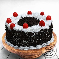 a black forest cake with cherries on top