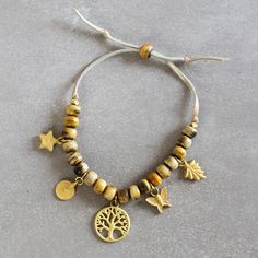 Bindu Natural Charm Bracelet - Ten Thousand Villages Brass Charms, Feel Special, Feeling Special, A Butterfly, Unique Charms, Adjustable Bracelet, How To Make Beads, Tree Of Life, Nature Inspired