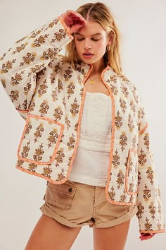 Stand out in this so special jacket featured in a slouchy, dolman-style silhouette and stunning floral print throughout designed to add the perfect touch to any look. * Dropped shoulders * Quilt-inspired fabrication * High-collar design | Chloe Jacket by Free People in White, Size: L Cropped Puffer Jacket, Quilted Puffer Jacket, Quilt Jacket, Mini Robes, Floral Jacket, Lightweight Shorts, Padded Coat, Looks Style, Long Blouse