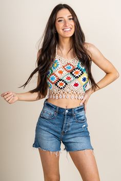 Crochet knit top from Lush Fashion Lounge women's boutique in Oklahoma City. Lush boutique in OKC has a variety of cute tops and more! This crochet top is perfect for Summer! Model is 5'7 size 24. 100% acrylic Knit Lace Top For Summer, Trendy Crochet Lace Tops For Spring, Trendy Fitted Top With Crochet Lace, Trendy Fitted Tops With Crochet Lace, Fitted Knit Top With Lace Detail, Trendy Fitted Tops With Crochet Trim, Multicolor Knit Crochet Top With Crochet Trim, Knit Tops For Vacation In Fall, Beige Knit Crop Top