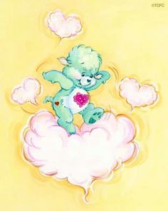 a blue teddy bear sitting on top of a cloud