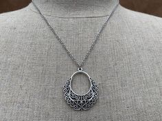 "Unique, pretty and stylish boho pendant necklace. It has incredible detail and design with it's whimsical filigree vibe. The perfect versatile everyday necklace. The pendant measures 1 3/8\" long by 1 1/4\" wide and is made from plated silver. It hangs from a shiny strong 18\" stainless steel necklace chain with a lobster clasp. I have a matching necklace in my shop, if you would like the whole set. Here is a direct linkhttps://etsy.me/3dGAnQG Thanks for stopping by! Please take a moment and vi Bohemian Sterling Silver Pendant Charm Necklaces, Bohemian Sterling Silver Charm Necklace With Lobster Clasp, Bohemian Nickel-free Pendant Necklace, Bohemian Sterling Silver Teardrop Pendant Necklaces, Bohemian Adjustable Necklace With Intricate Design, Bohemian Handmade Teardrop Pendant Necklace, Bohemian Nickel Free Oval Pendant Necklace, Bohemian Nickel-free Oval Pendant Necklace, Bohemian Pendant Charm Necklace