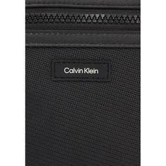 Brand: Calvin Klein Gender: Men Type: Bags Season: Spring/Summer PRODUCT DETAIL • Color: black • Fastening: with zip • Pockets: zip pockets • Size (cm): 20.5x16.5x6.5 • Details: -shoulder bags COMPOSITION AND MATERIAL • Composition: -98% polyester -2% polyurethane Modern Calvin Klein Business Bags, Modern Black Shoulder Bag With Logo, Modern Calvin Klein Shoulder Bag For Business, Black Bag With Logo Tag For Travel, Black Travel Bag With Logo Tag, Functional Business Bags With Logo, Modern Nylon Bag With Logo, Calvin Klein Business Rectangular Shoulder Bag, Modern Nylon Shoulder Bag With Logo