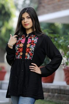 A stunningly marvellous Top. This Top features Kashmir Aari embroidery on Top's Yoke.- - - - - - - - - - - - - - - - - - - - Product Details- Condition: Brand New (made to order)- Style: Shirt Top- Fabric: Monga Cotton- Colour: Black- Embroidery: Kashmiri Thread Embroidery- Embroidery Colour: Multi-Colour- Standard Length: 27" (69 cm) approx. | Can be Customized - Care Instructions: Dry Clean Only**If you want the top to be shorter or longer, just send us a message, and we will tailor it accordi Festive Black Top With Chikankari Embroidery, Traditional Embroidered Black Tops, Traditional Black Embroidered Top, Traditional Embroidered Tunic Top, Black Cotton Folk Embroidered Top, Western Tops, Hippie Tops, Bohemian Women, Pleat Top