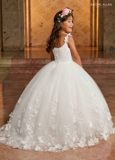 Your sweet girl will look like a fairy-tale Princess in this 3D floral applique long sleeveless dress with A-line skirt by Rachel Allan RB9142. This gorgeous glitter tulle ballgown is sure to make any flower girl feel like a princess. With beautiful 3D embroidery, this majestic dress is sure to make your sweet child stand out from the crowd in all the right ways. The cozy satin lining and lace-up back will keep your little one perfectly comfortable throughout any event. Rachel Allan promises a s Sleeveless Lace Pageant Dress With Lace Bodice, Princess Style Sleeveless Dress For Debutante Ball, Princess Style Sleeveless Debutante Ball Dresses, Sleeveless Dress With Sheer Bodice For Quinceanera, Princess Style Sleeveless Dress With Fitted Bodice, Sleeveless Tulle Pageant Dress With Fitted Bodice, Sleeveless Princess Dress With Fitted Bodice, Sleeveless Gown With Sheer Bodice For Pageants, White Sleeveless Princess Dress For Prom