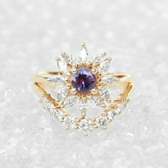 "Cluster round purple sapphire & diamonds engagement ring - Odyssey. Vintage and art deco style. Sapphire is September's birthstone. Listing is of the engagement ring alone. Ring details: ♥ Center stone: Beautiful natural round purple sapphire about 0.5ct. ♥ Side stones: Natural white diamonds, marquise cuts, about 0.60ct, F color, VS clarity. ♥ Material: 14K or 18k, yellow / white /rose solid gold. ♥ Sizes available: 4 - 11. ♥ You can request an IGL Jewelry certificate when ordering. Please Amethyst Wedding Ring With Brilliant Round Cut, Engagement Ring Purple, Lavender Sapphire, Sapphire Diamond Engagement, Diamonds Engagement Ring, Jewelry Certificate, Ring Purple, Promise Ring For Her, Purple Sapphire