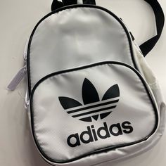 Selling This White Mini Adidas Backpack. Perfect Condition. Never Used Trendy Adidas Bags For Streetwear, White Casual Shoulder Backpack, Trendy Adidas Backpack For Back To School, Trendy Adidas Backpack, White Adidas Sporty Backpack, Trendy Adidas Standard Backpack, Adidas Sporty White Backpack, Adidas White Sporty Backpack, Trendy White Bags For Streetwear