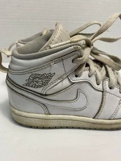 Kids Nike Air Jordan Retro 1 White Wolf Gray 640734-112 TD Sz 12c athletic shoes.  General wear throughout.  Fair condition.  Creasing to toes.  Some of midsole is loose.  Sold as pictured. Vintage Basketball Shoes With Boost Midsole And Round Toe, Vintage Synthetic Sneakers For Sports, Vintage Synthetic Sports Sneakers, Vintage Style Synthetic Sports Sneakers, Vintage Lace-up Synthetic Sneakers, Vintage Lace-up Basketball Shoes, Vintage White Basketball Shoes With Boost Midsole, Vintage White Custom Sneakers For Sports, Air Jordan Retro 1