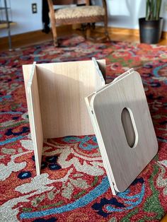 two pieces of wood sitting on top of a rug