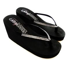 Black High Wedge Bridal Flip Flops with Crystal StrapsThese elegant black high wedge bridal flip flops feature a double row of crystals for lots of sparkle. This very popular bridal flip flop is the perfect accessory for any bride or bridesmaid looking for a comfortable yet trendy alternative to wedding shoes.Perfect for destination weddings!Many brides and bridesmaids are choosing to change into them at the reception for a comfortable way to dance without their gown dragging on the floor.The fl High Heel Flip Flops, Bridal Clothes, Bridal Flip Flops, Crystals Wedding, Crystals Black, Heeled Flip Flops, Rubber Sandals, Wedge Flip Flops, High Wedges