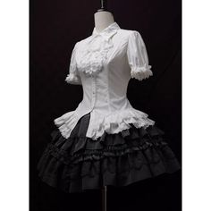 An item that will make you look like a mysterious and elegant young lady. It is richly decorated with lace embroidery and frills, and when paired with a bold chest ornament, it further enhances the gorgeous atmosphere. Like an aristocratic lady from medieval Europe. 
 
 

 

 
 
 
 Item 
 
 Blouse (black) + Jabot (black) 
 Blouse (purple) + jabot (purple) 
 Blouse (white) + Jabot (white) 
 Blouse (white) + Jabot (black) 
 Brooch (black x blue) 
 Brooch ( Black x Red) 
 Brooch ( Black x Purple) White Fitted Top For Costume Party, Fitted White Blouse With Lace Patchwork, White Fitted Blouse With Lace Patchwork, White Lace Patchwork Blouse For Party, Elegant Cotton Party Blouse, Elegant Cotton Blouse For Party, Classic White Cotton Victorian Dress, Elegant White Ruffled Tops, Elegant Short Sleeve Lace Blouse