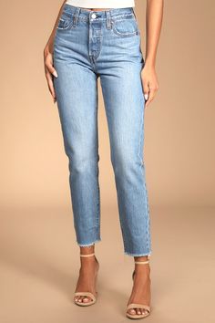 We just can't get enough of the Levi's Wedgie Straight Light Wash Distressed High-Rise Cropped Jeans! Sturdy denim (in Levi's Athens No Way wash) forms these incredibly cute and on-trend jeans with a five-pocket cut, belt loops, and high-waisted fit. Branded top button and hidden button fly top straight pant legs with frayed, cropped hems. Red logo tag and leather patch at back. Fit: This garment fits true to size. Length: Ankle length. Size 26 Waist: Fitted - very fitted at natural waist. Hip: Light Wash Stretch Cropped Bottoms, Fitted Mid-rise Bottoms With Frayed Hem, Fitted Light Wash Jeans With Frayed Hem, Chic Fitted Levi's Jeans, Classic Fitted Bottoms With Frayed Hem, Fitted Cropped Bottoms With Frayed Hem, Classic Tapered Leg Bottoms With Frayed Hem, Fitted Light Wash Pants With Five Pockets, Fitted Light Wash Pants With Frayed Hem