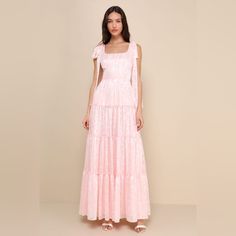 You'll Stand Out In Everyone's Memory With An Adorable Look Like The Lulus Picturesque Allure Blush Pink Jacquard Tie-Strap Maxi Dress! Lightweight Woven Fabric, With A Shiny, Burnout Floral Jacquard And Striped Pattern Throughout, Falls From Tying Straps Into A Flattering Square Neckline And A Princess-Seamed Bodice. High, Fitted Waist Sits Atop A Ruffled, Tiered Skirt That Finishes At An Elegant Maxi Hem. Smocked Panel At Back And Hidden Zipper/Clasp. New With Tags Inventory #R47 Lulus Bridesmaid Dresses, Rose Texture, Lulus Maxi Dress, Holiday Maxi Dress, Whimsical Dress, Floral Wrap Maxi Dress, Black Floral Maxi Dress, Strap Maxi Dress, Long Sleeve Wrap Dress