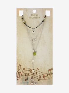 This necklace set hits all of the right notes! It features a cord necklace with a star charm and bead details  another necklace with a green bead and a music note  plus a musical lariat necklace full of stars  a treble clef charm and a music note charm hanging at the end. Music Note Necklace, Music Necklace, Indie Jewelry, Detailed Jewelry, Diy Jewelry Inspiration, Funky Outfits, Pretty Beads, Jewelry Accessories Ideas, Cord Necklace