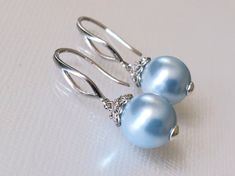 Wedding Light Blue Blush Blue Pearl Drop Silver Dangle Bridal Earrings. EARRINGS are about 1.18 inch (3cm) long from top of earring wire to bottom. BRIDAL EARRINGS SECTION: https://www.etsy.com/shop/LanaChayka?ref=seller-platform-mcnav§ion_id=11638940 BRIDAL JEWELRY SETS SECTION: https://www.etsy.com/shop/LanaChayka?ref=seller-platform-mcnav§ion_id=25839214 BRIDAL NECKLACES SECTION: https://www.etsy.com/shop/LanaChayka?ref=seller-platform-mcnav§ion_id=11638944 Elegant and classy, these earrings Elegant Blue Round Earrings, Elegant Blue Dangle Pearl Earrings, Light Blue Jewelry For Wedding, Elegant Blue Teardrop Pearl Earrings, Elegant Blue Pearl Drop Earrings, Elegant Blue Pearl Earrings, Elegant Blue Drop Pearl Earrings, Elegant Light Blue Teardrop Earrings, Elegant Blue Teardrop Bridal Earrings