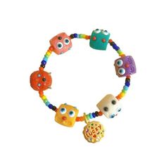 a bracelet with colorful beads and skulls on the front, one bead has an eyeball