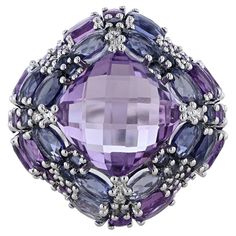 This ring is made in 14K white gold and features amethyst weighing 9.12 carats. Along with Iolite weighing 4.29 carats, and diamonds weighing 0.06 carat. Ladies Rings, Contemporary Ring, Dome Ring, Domed Ring, Gold Rose, Fashion Rings, Women Rings, A R, Jewelry Rings