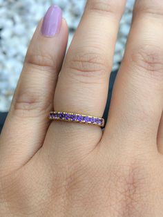 Eternity Band Ring with Genuine Amethyst. Material: Solid Gold Finish: High Polished/ Shiny Fit: Standard Width: 2.7mm Weight: 4+ grams Setting: Prong Set French Pave Stone: Natural Amethyst Cut & Shape: Diamond Cut, Round Quality: AAA Quanity of Stones: 11 Total Carat Size: apx. 0.40 ct This Ring is Full of Elegance and Beauty! It is so Simple and so Complete at the same time! One can wear this band alone by itself or match it with Engagement Solitaire Ring to make a Wedding Set (Bridal Set Yellow Gold Amethyst Ring With Prong Setting For Promise, Yellow Gold Amethyst Ring With Accent Stones For Promise, Fine Jewelry Amethyst Stackable Wedding Rings, Amethyst Promise Ring With Accent Stones, Wedding Amethyst Stackable Rings Fine Jewelry, Yellow Gold Amethyst Crystal Ring For Anniversary, Amethyst Crystal Ring In Yellow Gold For Anniversary, Purple Crystal Promise Ring, Classic Purple Jewelry For Promise