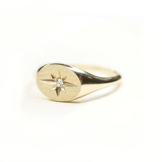 14k Solid Gold Starburst Signet Ring Our new stunning 14k Solid Gold Signet Ring is a timeless addition to your ring collection. Featuring a genuine .025 Carat diamond Built to last a lifetime and more. Please note, this ring comes standard in a polished face. Brushed finished is available upon request. Luxury Traditional Yellow Gold Signet Ring, Heirloom 14k Gold Diamond Ring With Polished Finish, 14k Gold Celestial Oval Rings, Classic Yellow Gold Star-shaped Diamond Ring, 14k Gold Oval Celestial Signet Ring, Celestial Signet Ring With Polished Finish For Anniversary, Celestial Oval 14k Gold Signet Ring, Celestial Style Diamond Signet Ring In Yellow Gold, Celestial Style Signet Ring For Anniversary