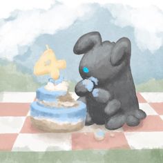 a black teddy bear sitting next to a cake on a checkerboard tablecloth