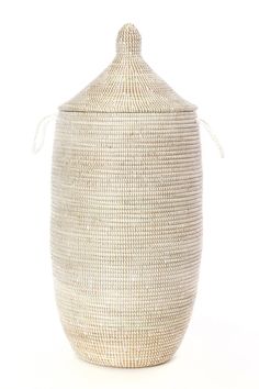 a large white basket with handles on the top and bottom, sitting in front of a white background