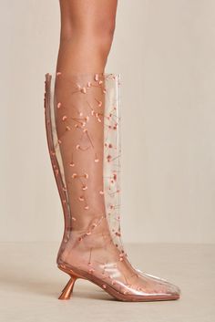 An Italian vinyl boot with real pressed flowers accentuated by a satin toe cap and satin heel. — Italian vinyl — Real pressed flowers — Satin toe cap, footbed, and heel — Zip opening Donkey Skin, Icon Clothing, Evening Flats, Sandal Platform, Swimming Bag, Satin Heels, Candle Collection, Cult Gaia, Boot Accessories