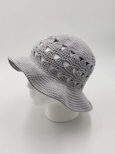 Happy Summer  This fun, light and airy brimmed crochet sun hat is the perfect accessory for summer, spring or anytime you're outdoors in the sun and is available in several colors.  Wear it at the beach, on a hike, while gardening, at a picnic, at the park, at the pool, at a barbecue, on vacation or anytime to protect your face and eyes from the sun.  Having a bad hair day?  This hat is the perfect fix.  It also makes a terrific gift. Handmade with 100% cotton yarn.  It is lightweight, washable and convenient to travel with. Machine wash gentle cycle or hand wash in cold water.  Roll in a clean towel to remove excess moisture then lay flat to dry.   MADE TO ORDER - This sun hat is Made to Order.    COLOR:   My lead (processing) time varies according to my yarn inventory.   If I have the co Crochet Yarn Hats For Vacation, Crochet Cotton Yarn Vacation Hats, Adjustable Beachy Crochet Hat For Summer, Adjustable Beachy Crochet Hat For Warm Weather, Adjustable Crochet Yarn Hat For Vacation, Warm Weather Crochet Bucket Hat, Lightweight Yarn Straw Hat For Spring, Summer Crochet Hat With Short Brim For Outdoor, Brimmed Yarn Sun Hat For Spring