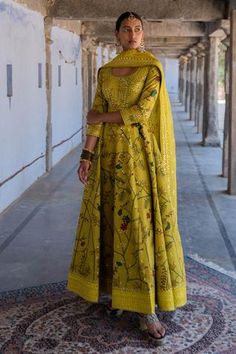 Mustard handwoven chanderi silk anarkali with kalamkari hand painted motifs and mirror embroidery. Paired with mirror work dupatta.
Component: 2
Pattern: Embroidered, Hand Painted
Type Of Work: Mirror, Kalamkari
Neckline: Scoop
Sleeve Type: Three Quarter Sleeves
Fabric: Anarkali: Handwoven Chanderi Silk
Color: Yellow
Other Details: 
Mirror work
Floral motifs
Occasion: Wedding
Disclaimer: This product will be exclusively handcrafted, making the colour/texture/pattern slightly vary from the image Kalamkari Anarkali, Archana Jaju, Yellow Anarkali, Yellow Mirror, Anarkali With Dupatta, Silk Anarkali, Sharara Set, Designer Gowns, Embroidered Silk