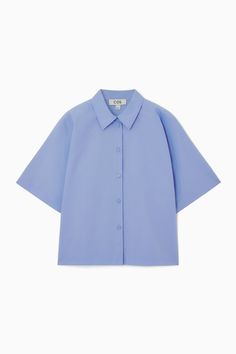 Swap out your long-sleeved shirts for this summery version as the weather warms. It's crafted from pure cotton-poplin that has a naturally breathable quality and designed in a slightly boxy shape that'll work just as well tucked in as it will left loose over skirts and pants.- Regular fit- Button closure- Short sleeves100% Cotton / Machine washBack length of size  6 is 22.04" / Model wears a size 6 Cotton Relaxed Fit Camp Shirt For Daywear, Relaxed Fit Cotton Camp Shirt For Daywear, Spring Solid Cotton Camp Shirt, Short Sleeve Poplin Tops For Work, Short Sleeve Poplin Blouse For Spring, Relaxed Cotton Camp Shirt For Daywear, Long Sleeve Poplin Tops For Summer, Spring Short Sleeve Poplin Blouse, Collared Cotton Short Sleeve Shirt For Daywear