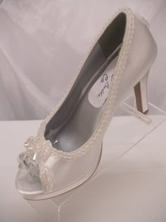 SALE THIS PAIR ONLY REG PRICE: $162.00 NOW: $138.00 READY TO SHIP SHOES USA SIZE: 5.5 (5 1/2), AS SHOWN IN PICTURE. *If you need a different color or size please see below. Beautiful Shoes for Todays Brides! : 3 1/4'' Heels Beautifully embellished with iridescent pearls edging; Shoes are peep toes with an iridescent embellishment, soooo, cute Shoes have platform to rest your feet :) the back heel of the shoe has a cute iridescent embellishment, please look at all the pictures *Need this shoe is Embellished Fitted Round Toe Wedding Shoes, White Open Toe Wedding Shoes For Gala, Fitted Silver Open Toe Wedding Shoes, Silver Open Toe Fitted Wedding Shoes, Open Toe Embellished Wedding Shoes For Formal Occasions, Modern Cinderella, Fancy Heels, Pretty Heels, Iridescent Color