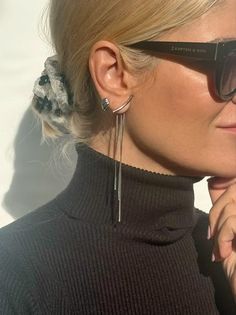 Introducing our exquisite Long Silver Earrings - a fine masterpiece exclusively crafted for you. Expertly handcrafted from high-quality stainless steel, this unique pair features three delicate minimal chains of varying lengths gracefully embraced by a seamless push back closure. The pièce de résistance lies in the stunning silver bar adorning the front, lending an extraordinary charm to the final creation. Lightweight and remarkably comfortable, these earrings epitomize elegance and are availab Elegant Metal Wrap Earrings With Ear Wire, Minimalist Pierced Earrings For Evening, Elegant Silver Teardrop Wrap Earrings, Modern Dangle Threader Earrings As Gift, Elegant Metal Ear Climbers As A Gift, Formal Metal Drop Wrap Earrings, Elegant Single Ear Climber For Parties, Elegant Metal Ear Climbers As Gift, Elegant Silver Drop Wrap Earrings